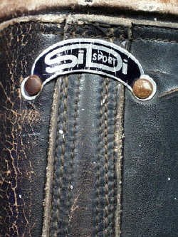 Original metal tag on back of boot.